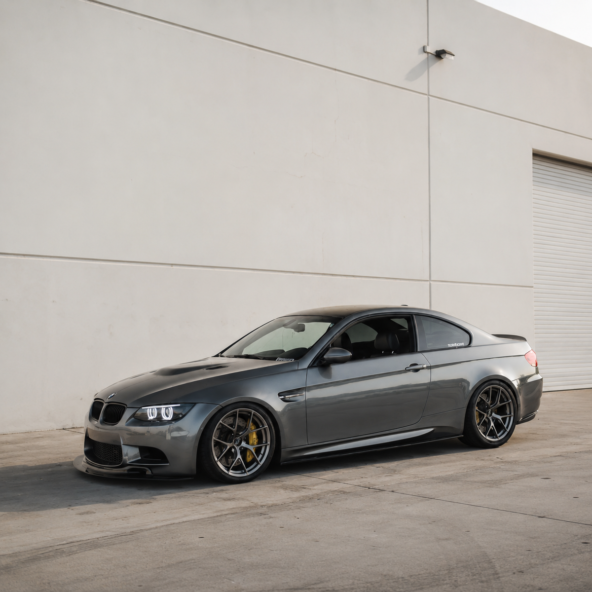 AlpineX Dynamics MP Style Carbon Fiber Side Skirt installed on a BMW E9X M3, shown from the side.
