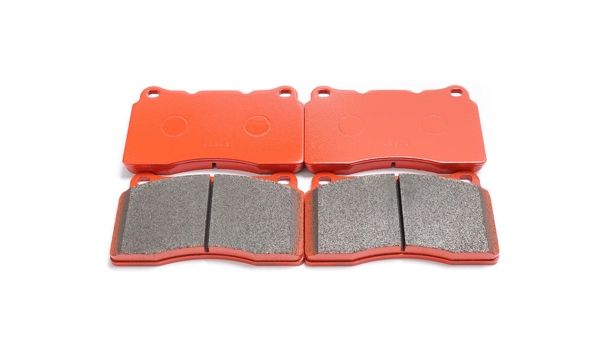 Paragon PBP370 brake pads showing friction faces and red backing plates