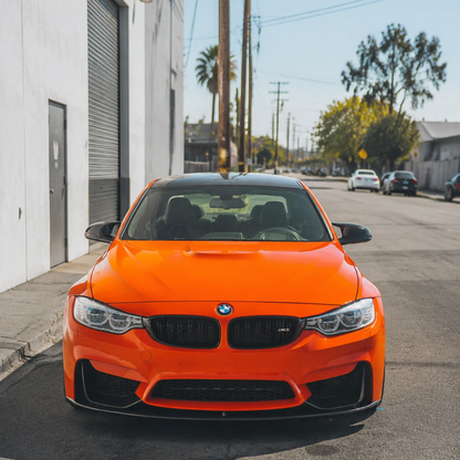 AlpineX Dynamics MP Style Carbon Fiber Front Lip installed on a BMW F8X M3/M4, shown from the front.