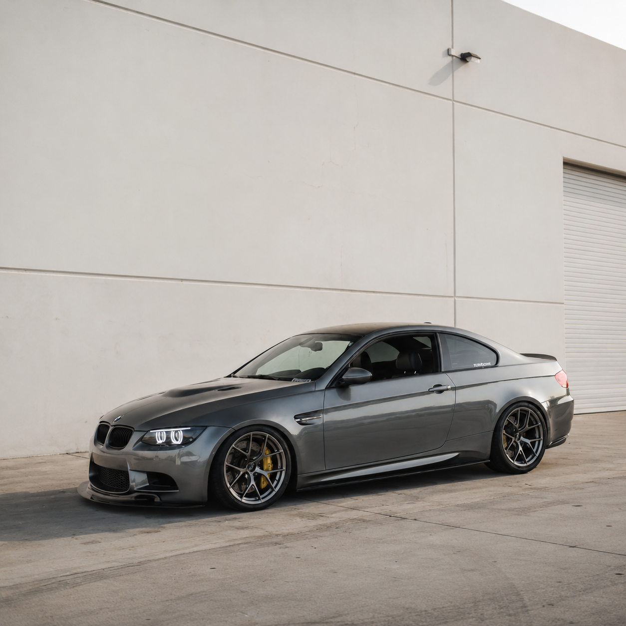 AlpineX Dynamics MP Style Carbon Fiber Side Skirt installed on a BMW E9X M3, shown from the side.