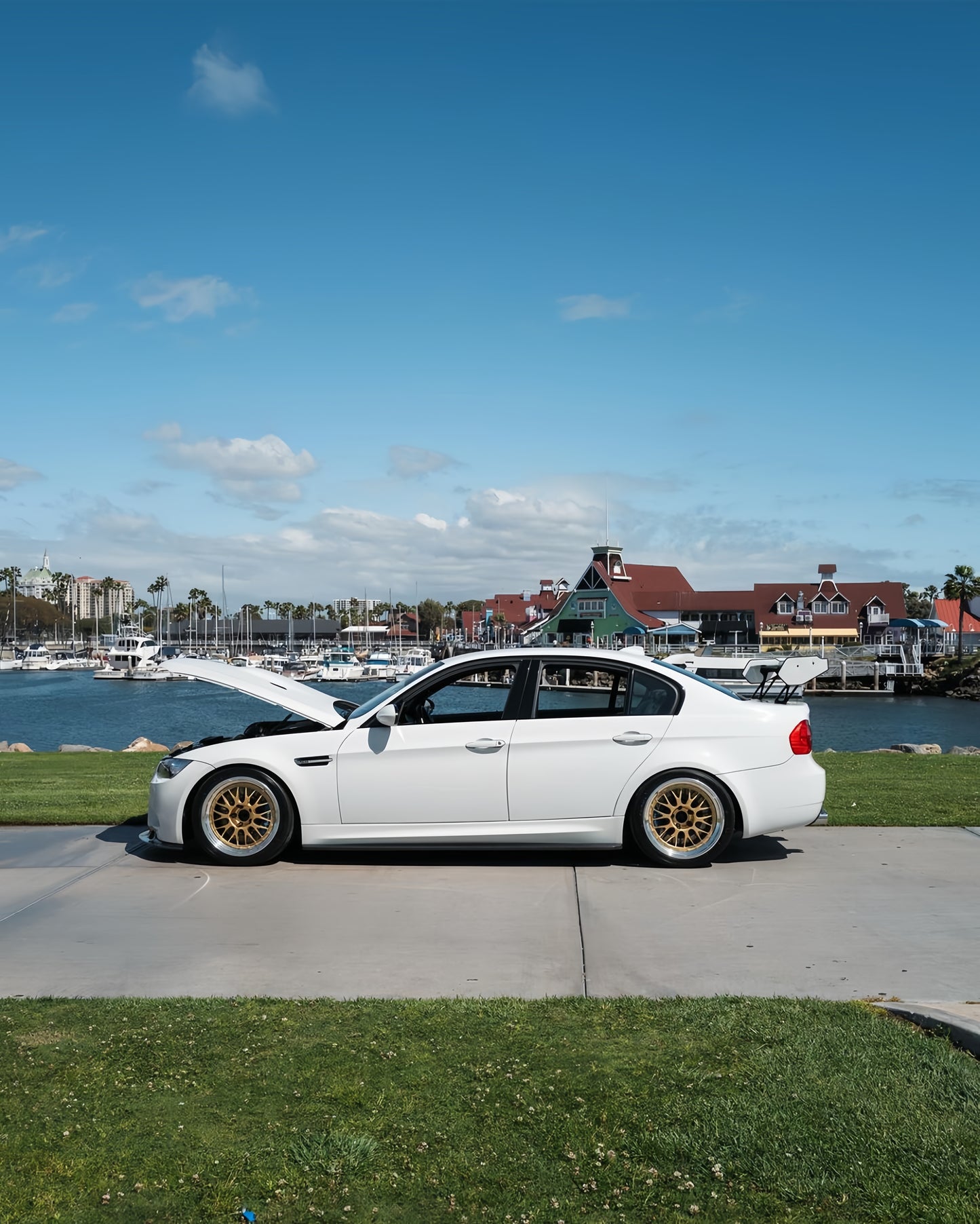 White BMW E90 M3 with M235iR carbon fiber rear wing in side view