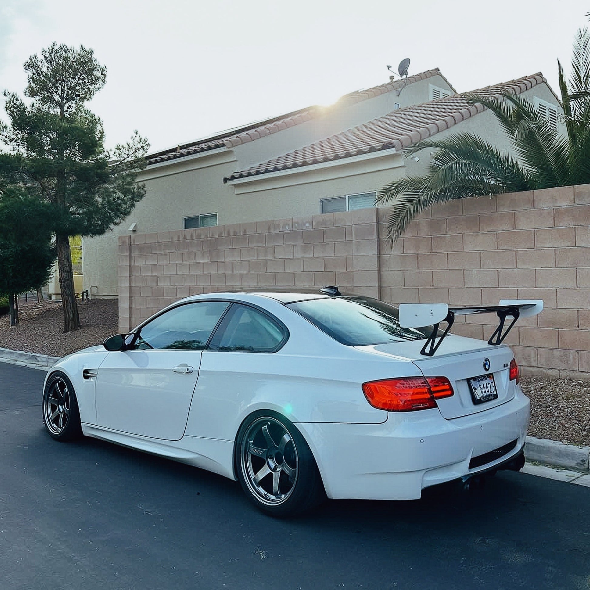 White BMW E92 M3 with M235iR rear wing in rear three-quarter view