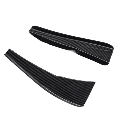 Pair of AlpineX Dynamics GT4 style carbon fiber canards for BMW E9X M3, showing the curved profiles and glossy woven surfaces on a white background