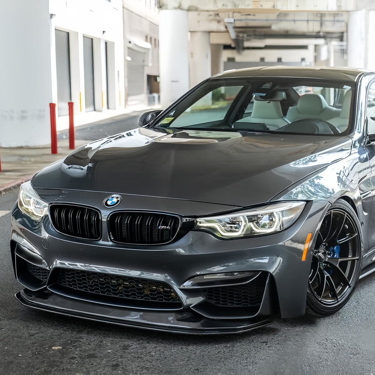 Gray BMW F82 M4 with GTS-style adjustable carbon fiber front splitter installed