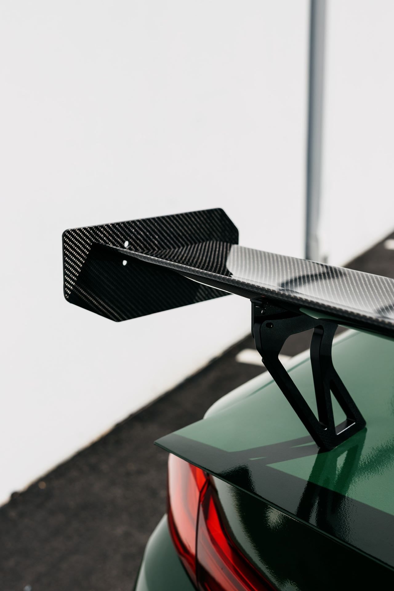 BMW F82 M4 with Ring Spec Wing V2 showing dry carbon wing and mount detail