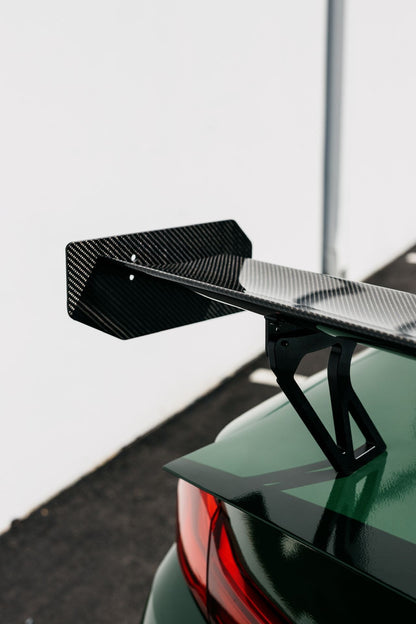 BMW F82 M4 with Ring Spec Wing V2 showing dry carbon wing and mount detail