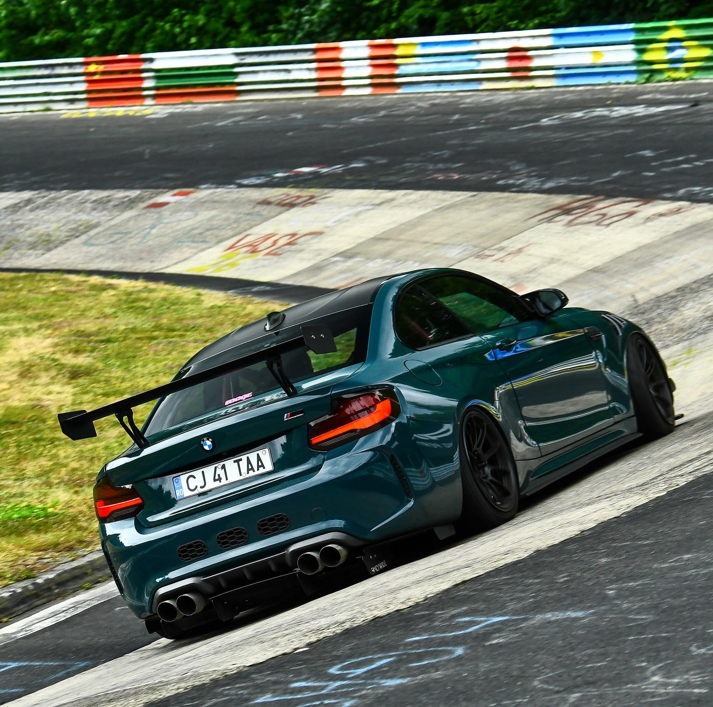 BMW F87 M2 with Ring Spec Wing V2 driving on the Nürburgring