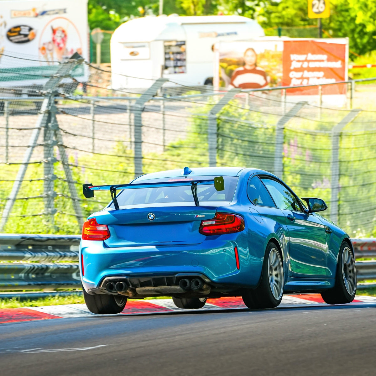 BMW F87 M2 with Ring Spec Wing V2 on track