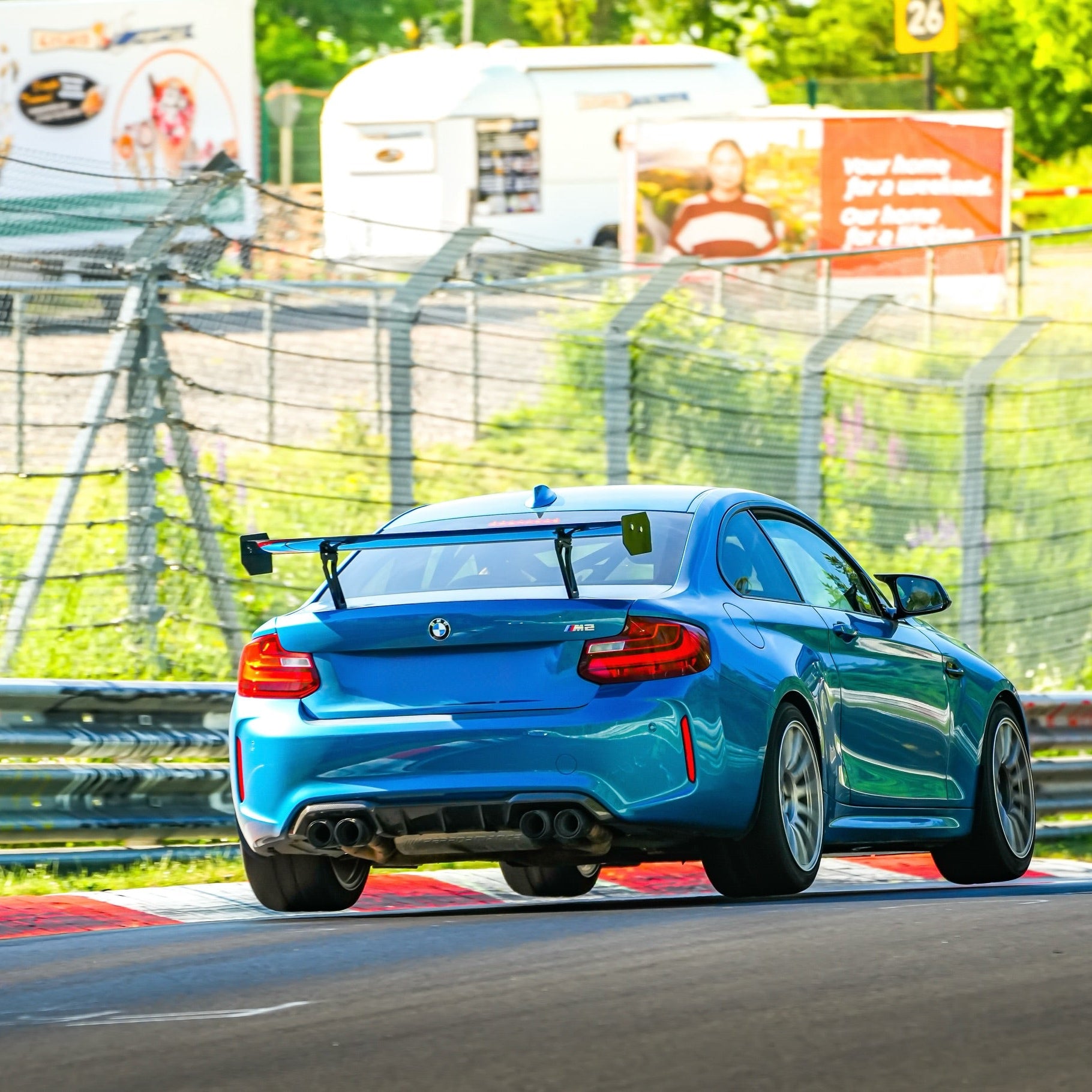 BMW F87 M2 with Ring Spec Wing V2 on track
