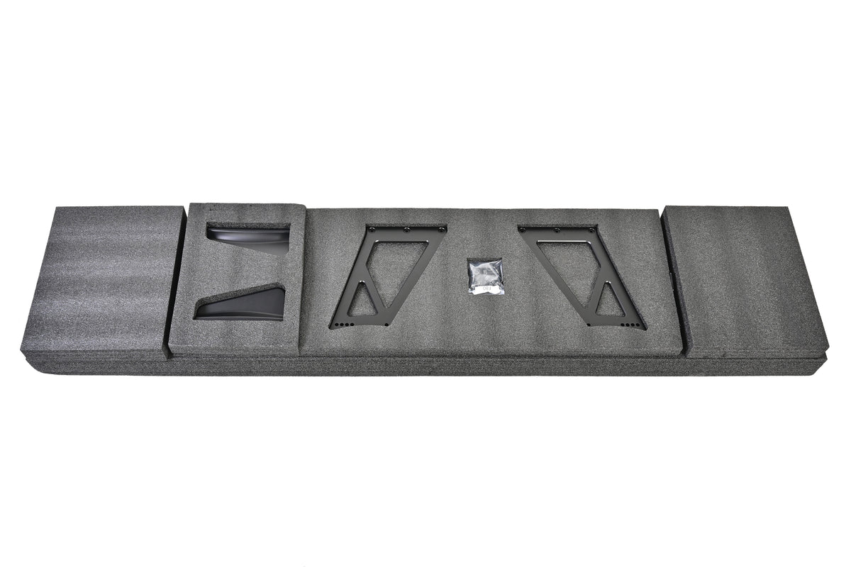 RM Engineering GT4+ wing uprights, carbon fiber endplates, trunk mounting bases and installation hardware in protective packaging