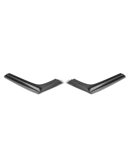 Top angled view of the two carbon fiber side extensions from the AlpineX Dynamics V style three-piece rear diffuser for BMW F8X M3/M4, arranged symmetrically on white