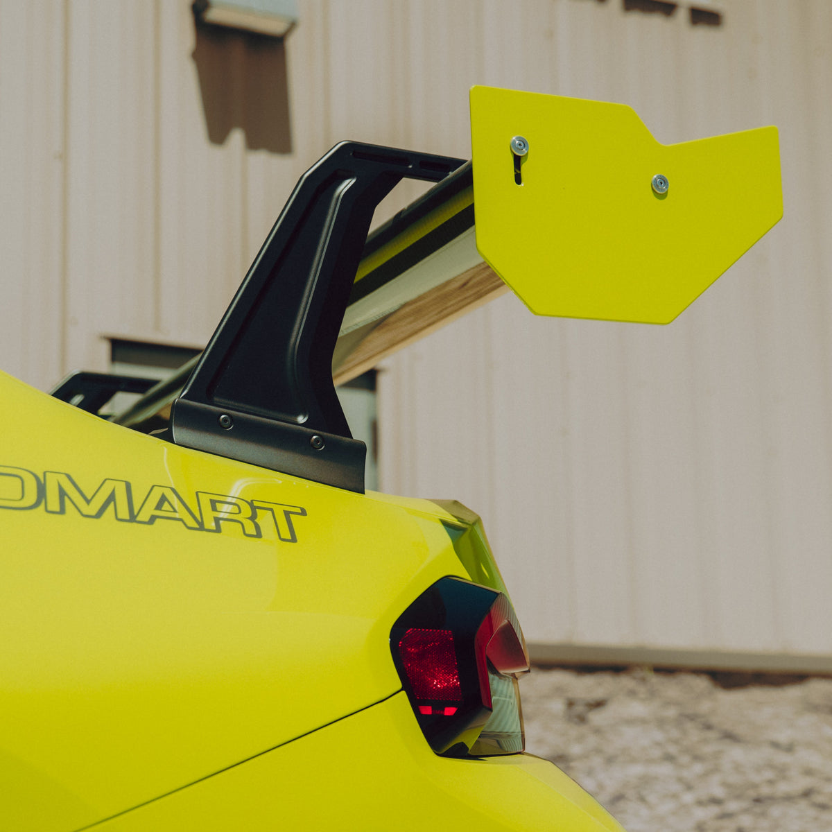 Rear detail of the GT4+ wing endplate, mainplane and swan-neck upright installed on a BMW G87 M2