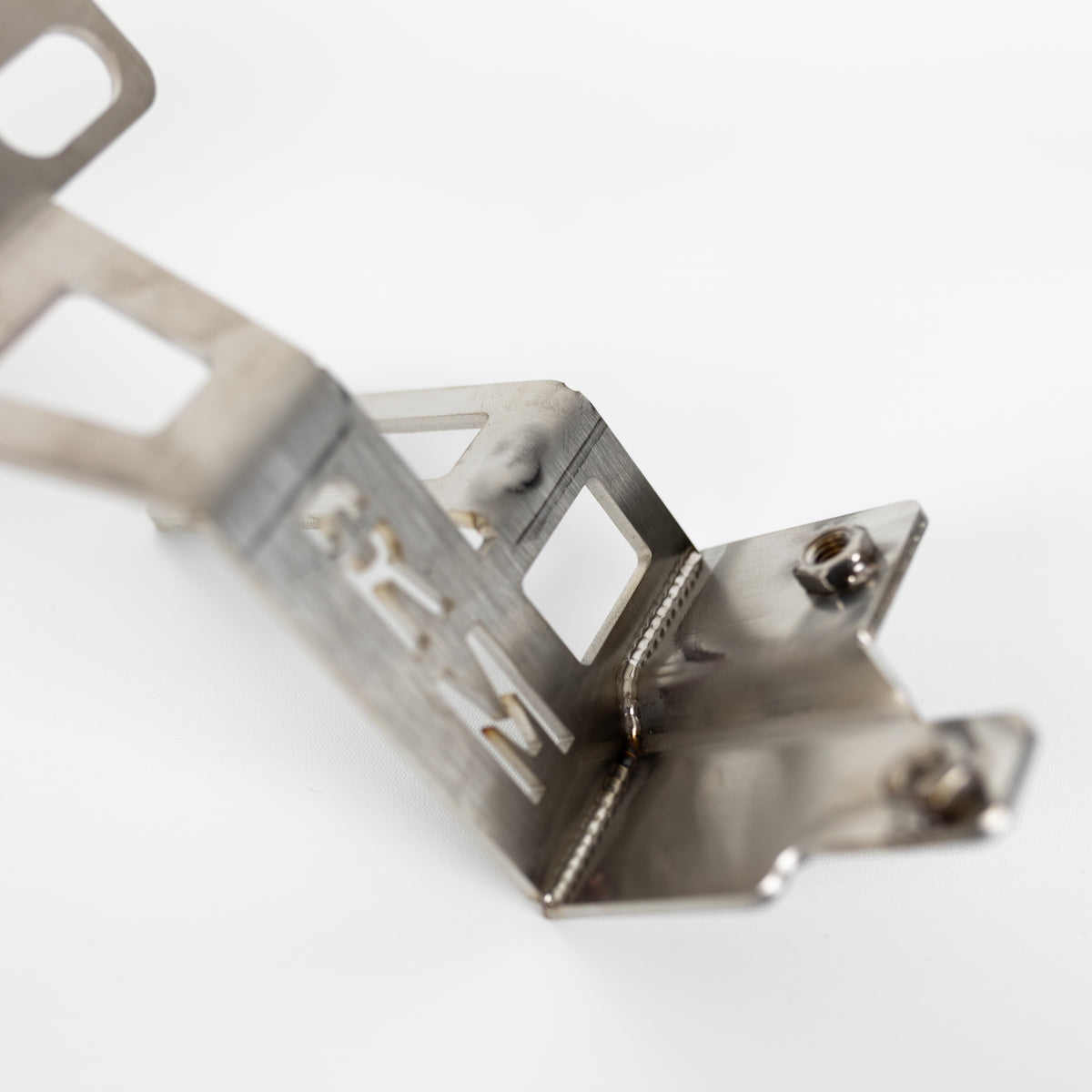 Welded stainless steel chassis-mounting bracket for the F87 M2 Competition front splitter