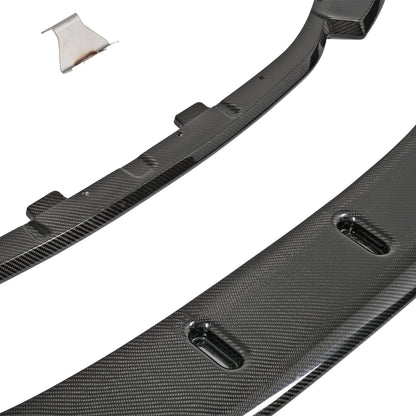 Close-up of the BMW G87 M2 pre-preg carbon fiber upper lip and adjustable lower splitter showing the slotted mounting points