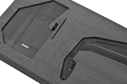 Close-up of a pre-preg carbon fiber endplate and swan-neck upright for the BMW G87 M2 GT4+ rear wing
