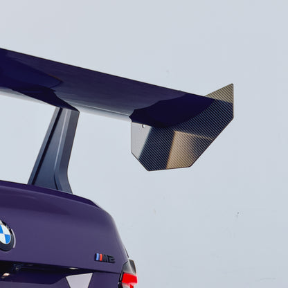 Installed detail of the carbon fiber endplate and mainplane on an Ultraviolet BMW G87 M2 GT4+ rear wing