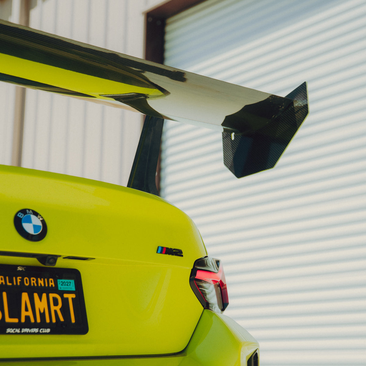 Underside view of the BMW G87 M2 GT4+ carbon fiber wing mainplane, endplate and swan-neck support