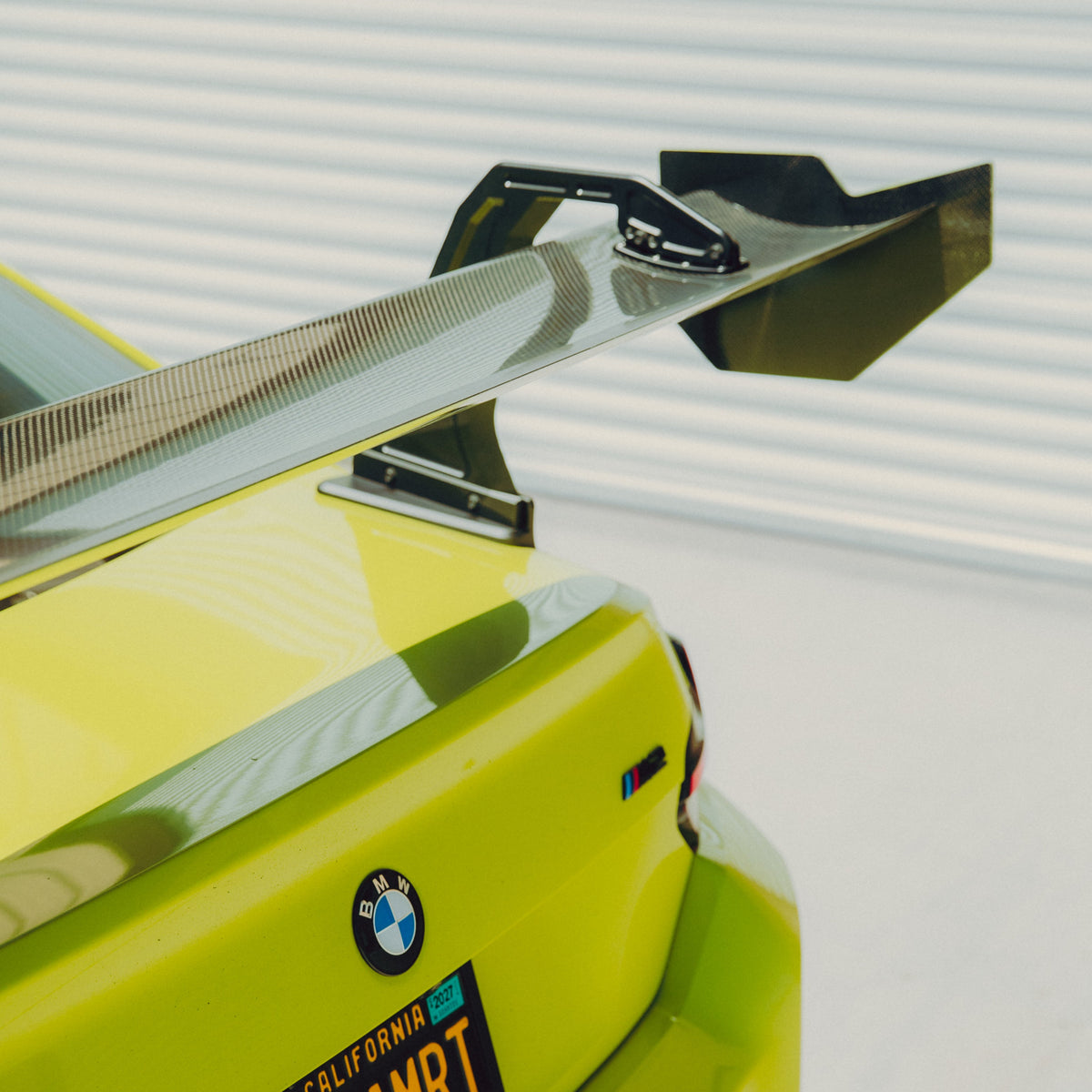 Close-up of the pre-preg carbon fiber mainplane and endplate on the BMW G87 M2 GT4+ rear wing
