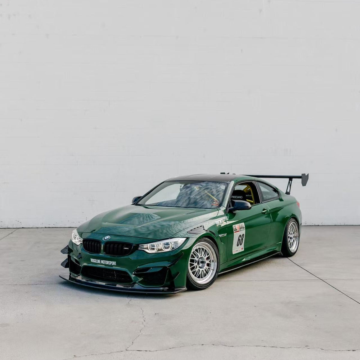 Green BMW F82 M4 with GT4+ front splitter kit