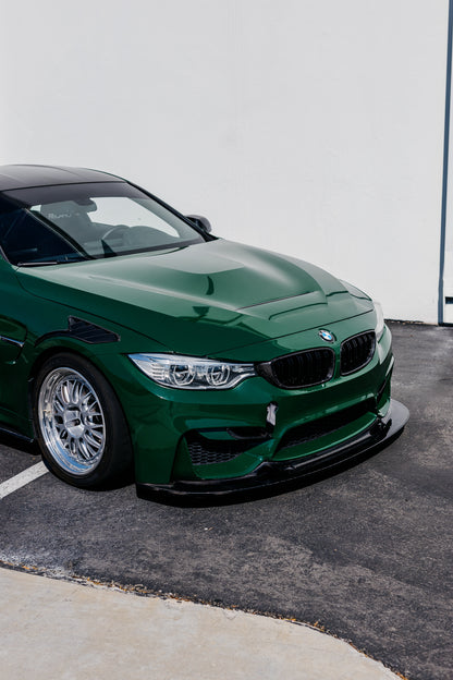Green BMW F82 M4 fitted with the GT4 V2 longer carbon fiber front splitter