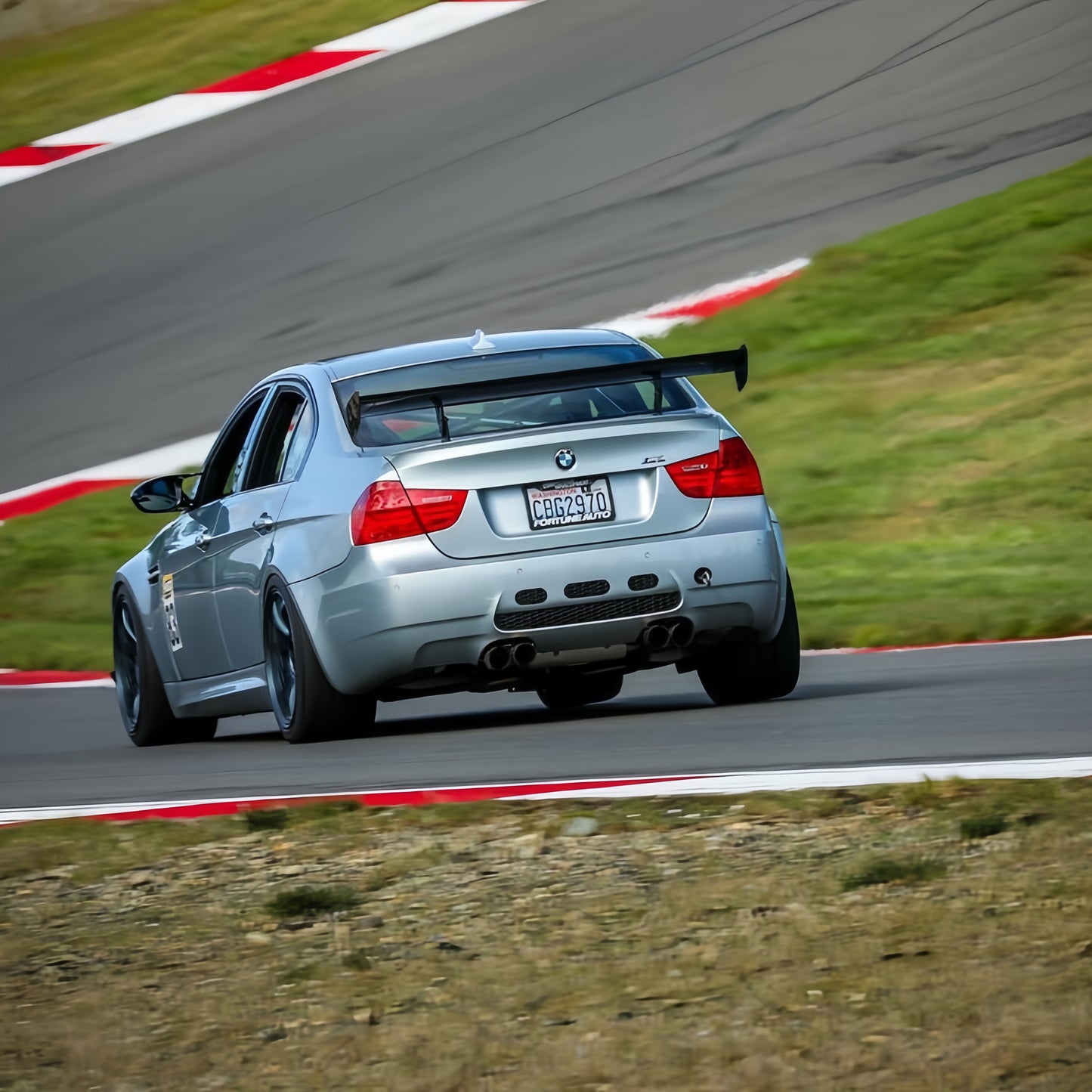 Silver BMW E90 M3 track car with GT4 MK2 rear wing
