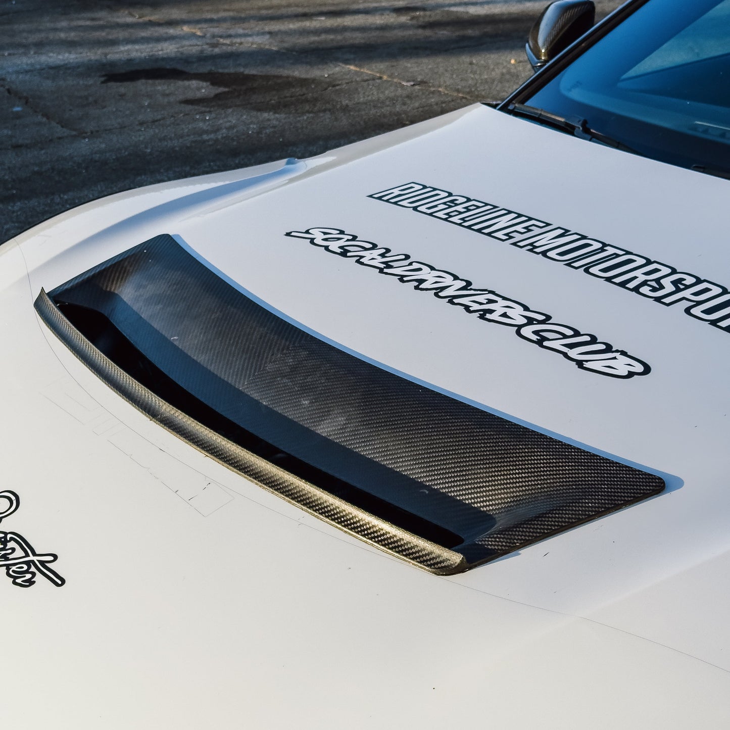 Carbon fiber GT4+ heat-extraction hood vent installed on a Toyota GR Supra A90