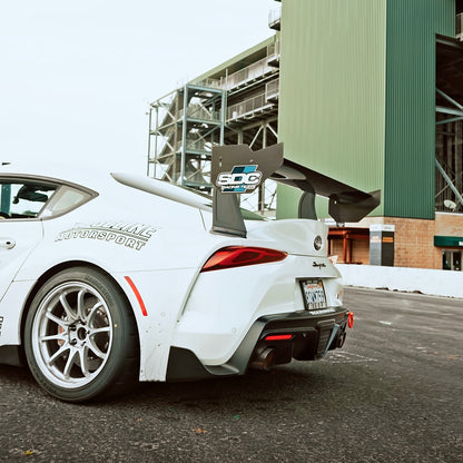 White Toyota GR Supra A90 with RM Engineering GT4+ carbon fiber rear wing installed