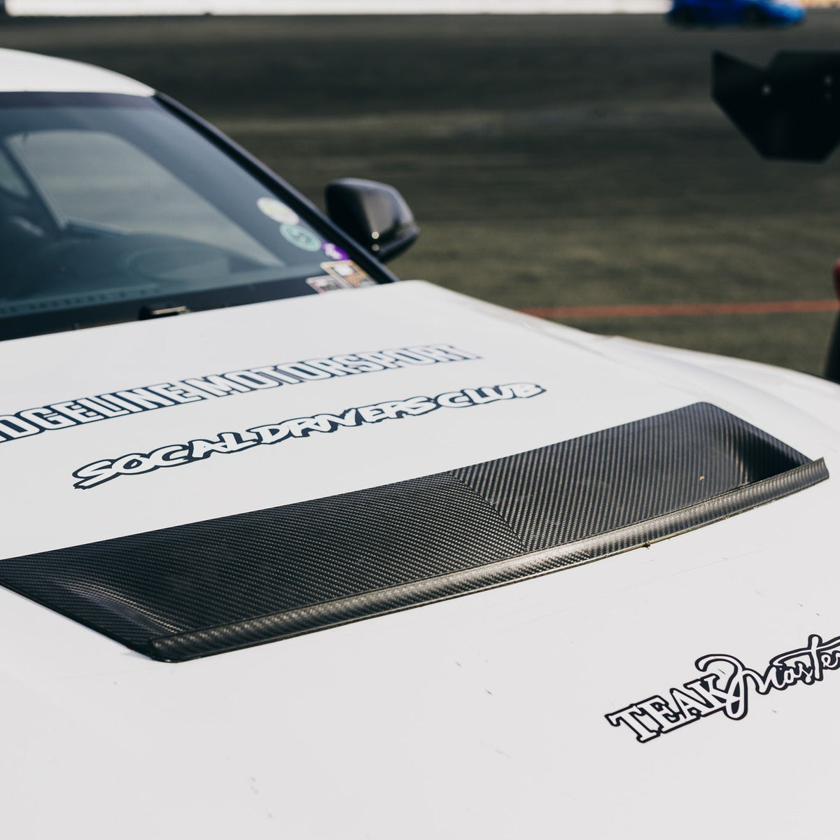 GT4+ carbon fiber hood vent installed on a track-prepared Toyota GR Supra A90