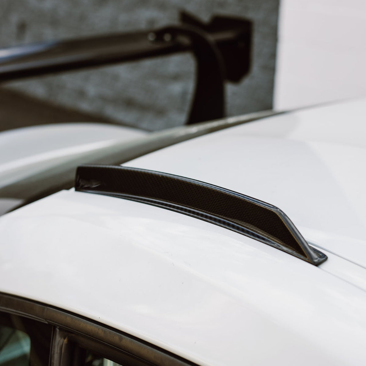 Side detail of the GT4+ RS carbon fiber roof fin installed on a Toyota GR Supra