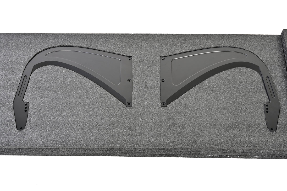 Pair of aluminum swan-neck uprights for the Toyota GR Supra GT4+ rear wing in protective packaging