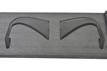 Pair of aluminum swan-neck uprights for the Toyota GR Supra GT4+ rear wing in protective packaging