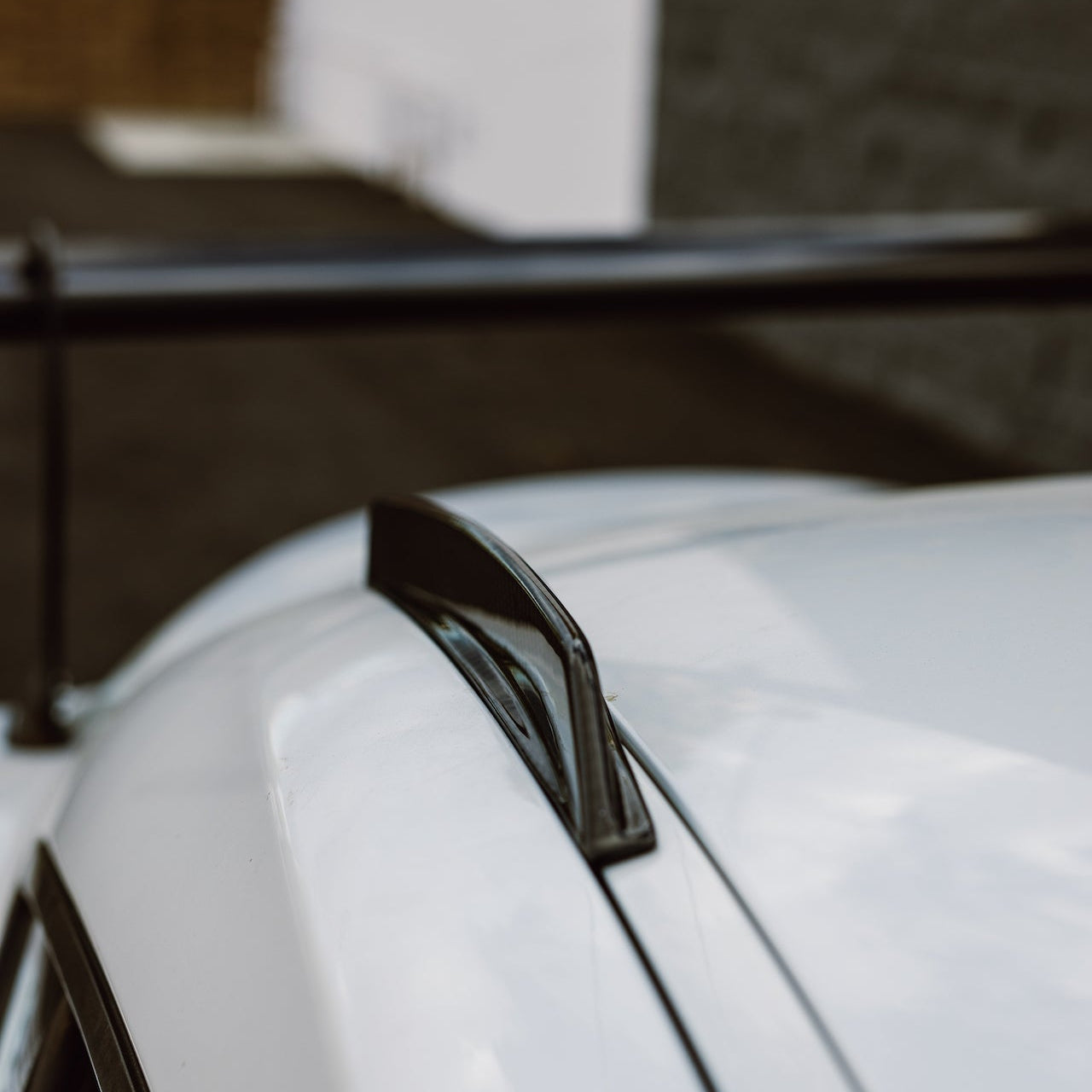 Rear section of the carbon fiber roof fin installed above the Toyota GR Supra rear glass