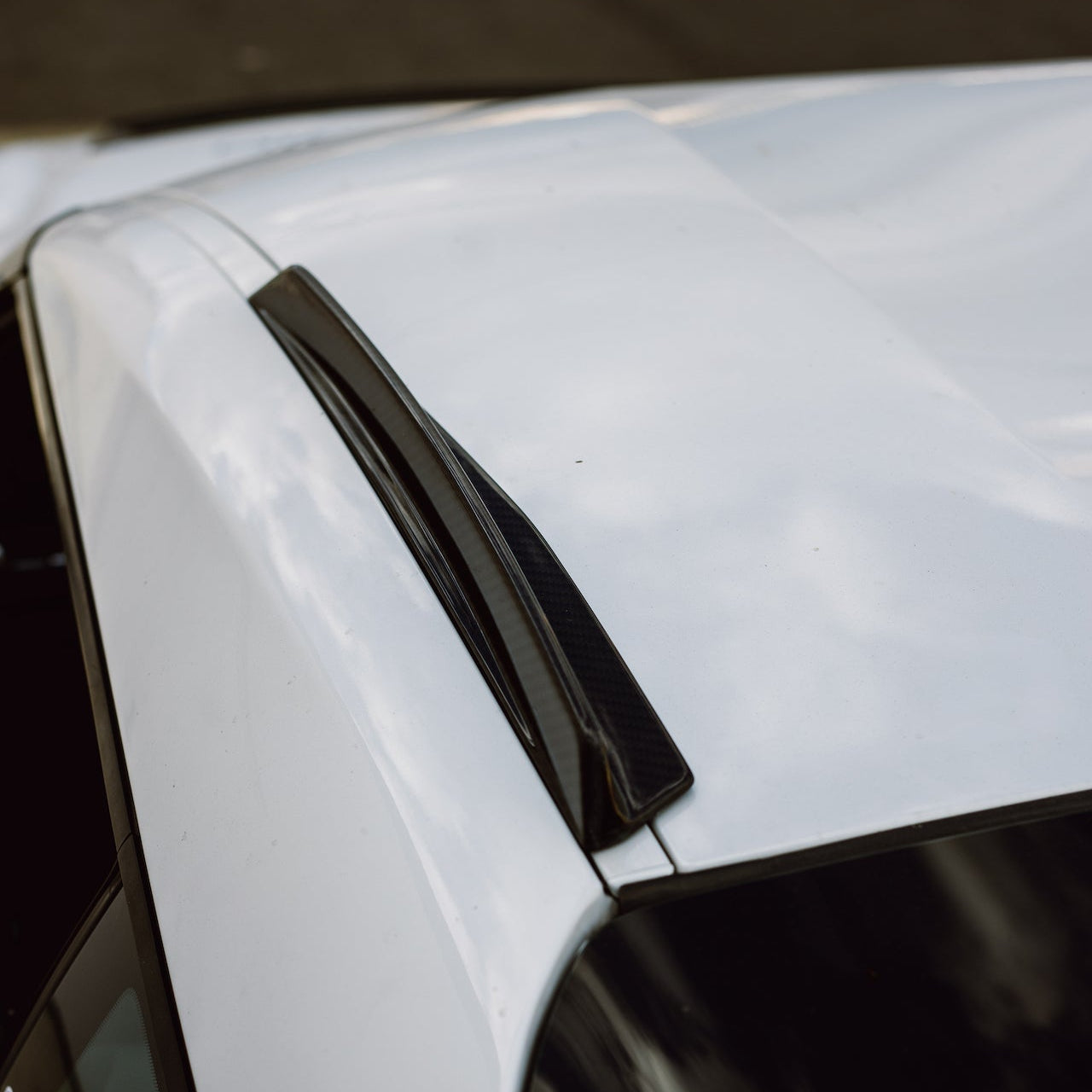 Top view showing both GT4+ RS carbon fiber roof fin sections aligned along the Supra centerline