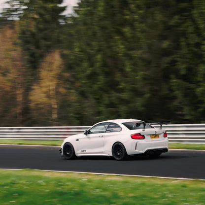 White BMW E92 M3 with GT4 MK2 rear wing on track