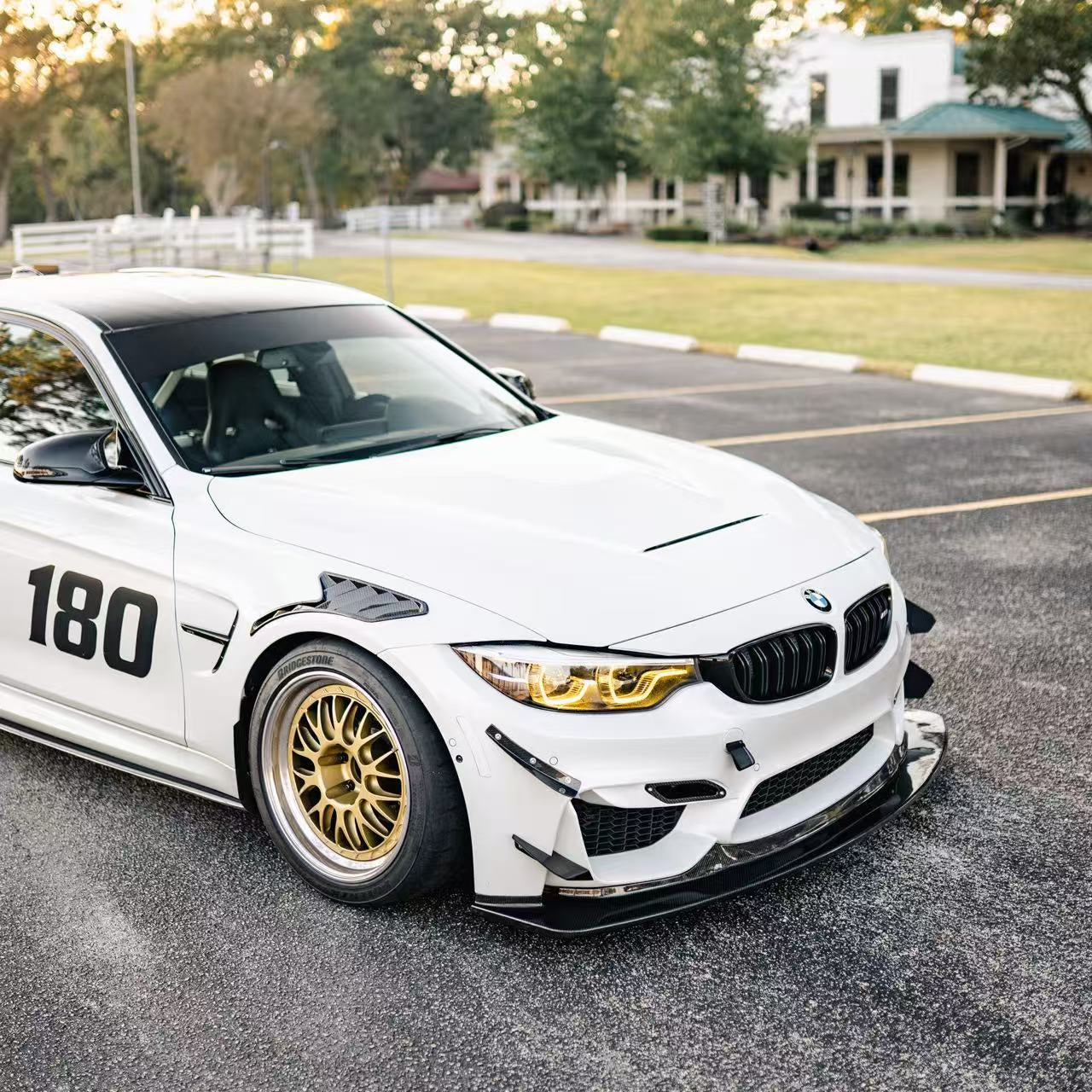 White BMW F82 M4 with RM Engineering GT4+ front bumper canards and splitter