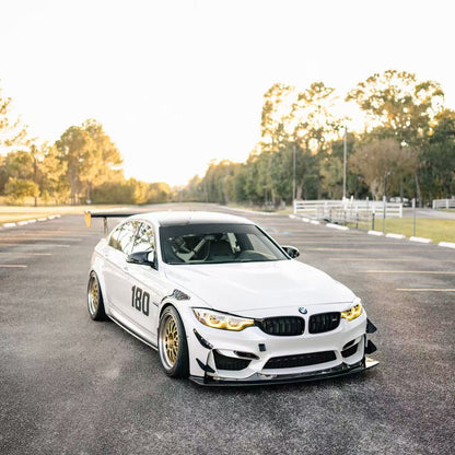 White BMW F82 M4 track build with GT4+ front splitter and canards
