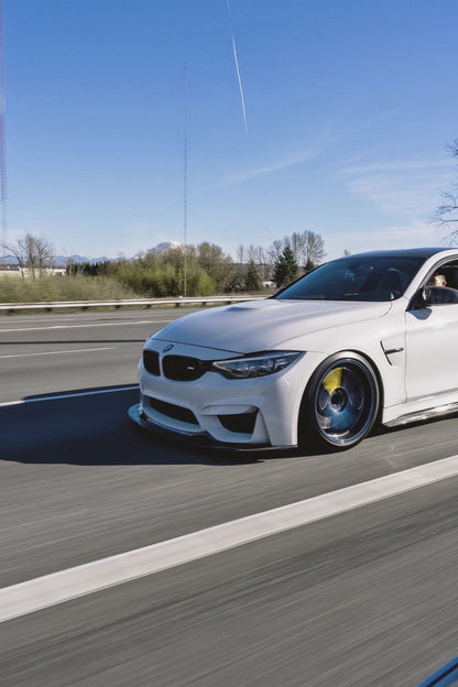 White BMW F82 M4 driving with Ridgeline Motorsport GT4 V1 front splitter